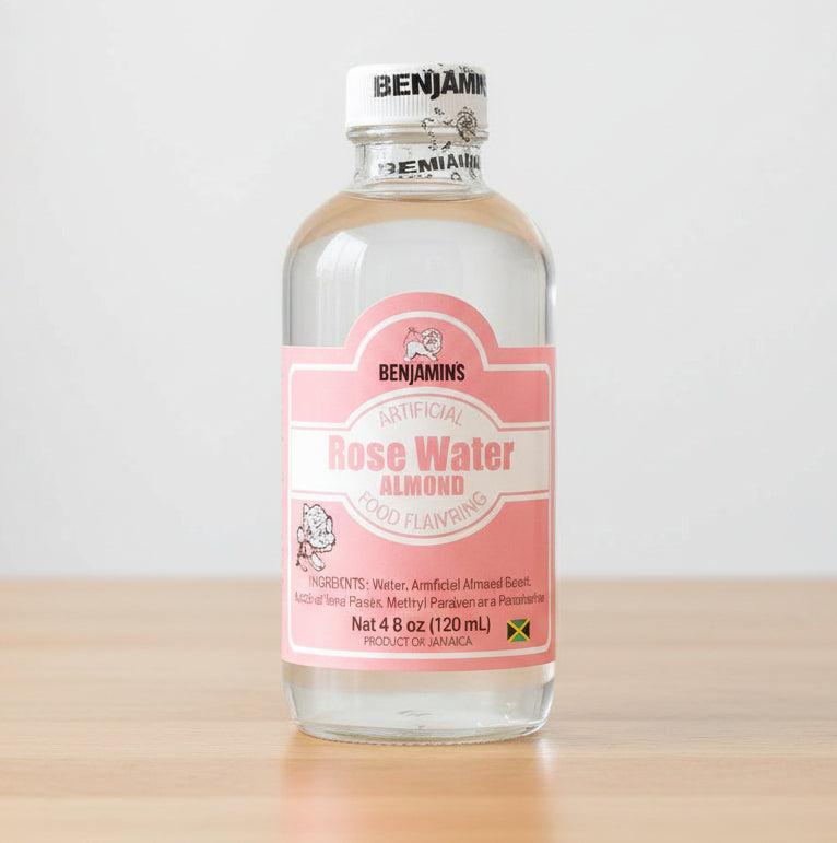 Bottle of rose water with a pink label on a white background