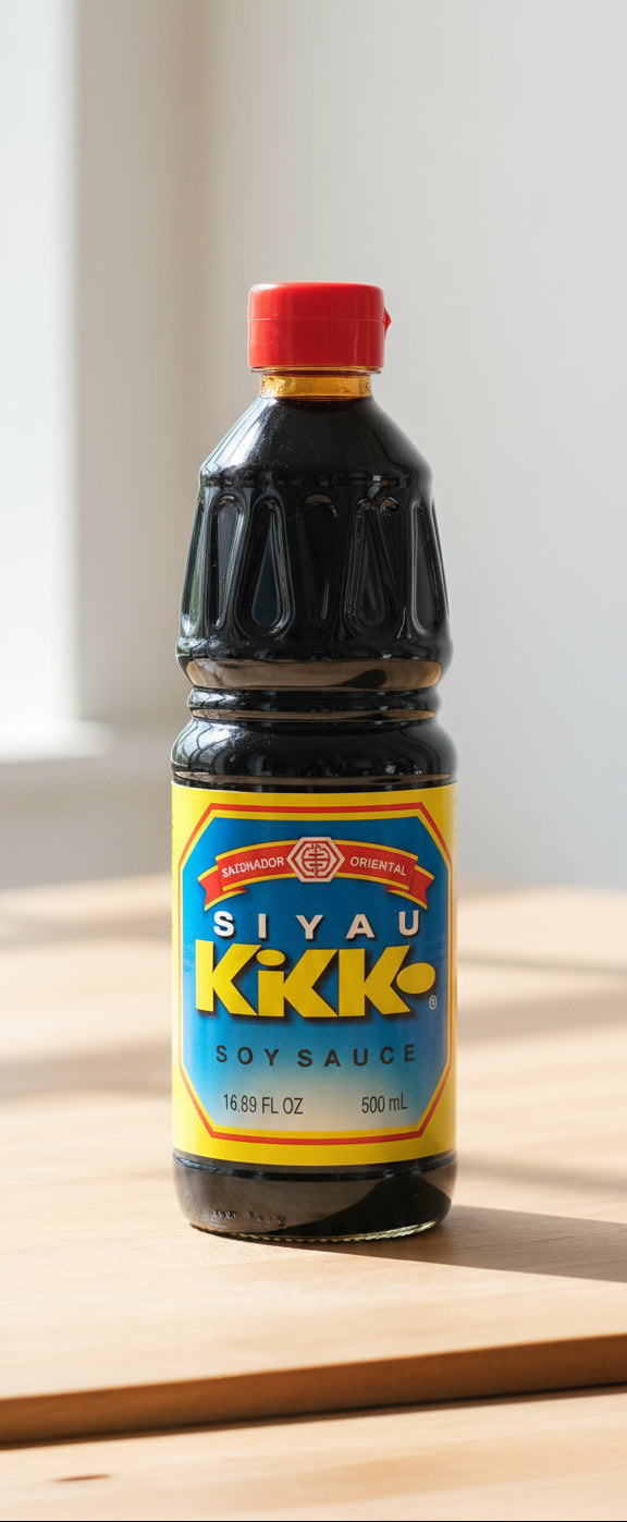 Bottle of Siyau Kikkk soy sauce with a red cap and blue label.