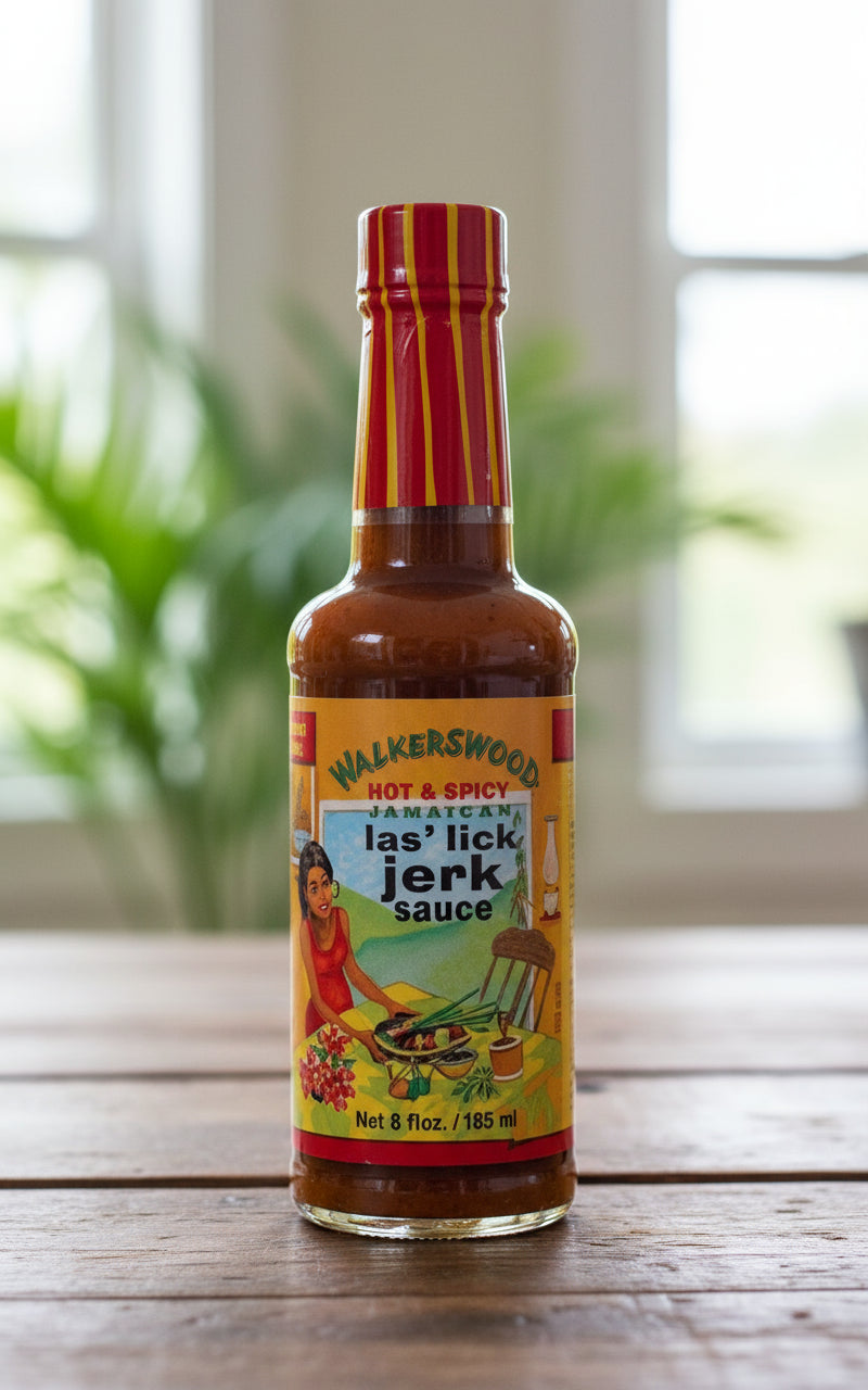 Bottle of Walkerswood Jerk Sauce with colorful label on a white background