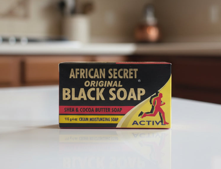 Bar of African Secret Original Black Soap on a surface with a blurred background