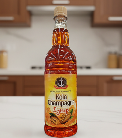 Bottle of Kola Champagne syrup with a visible brand logo on a white background