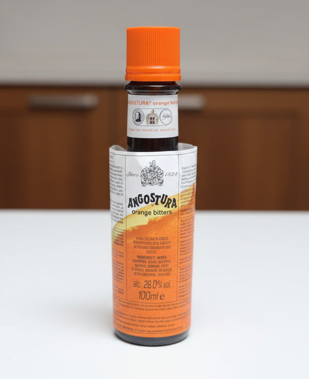 Bottle of Angostura bitters on a dark surface