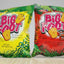 Two packages of BIG FOOT cheese snack, one green and one red, both with the BIG FOOT logo and images of cheese puffs.