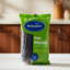 Green package of Belmont purple corn with blue label on a white background