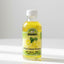 Bottle of lemon-flavored liquid with a label on a white background