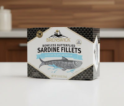 Package of Brunswick boneless butterflied sardine fillets on a white background