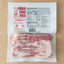 Packaged cubed pork tails with label on a wooden surface