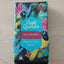 Café Quindio gourmet coffee package with colorful design on a dark background