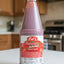 Bottle of Cal's Tomato Ketchup with a price tag in the background