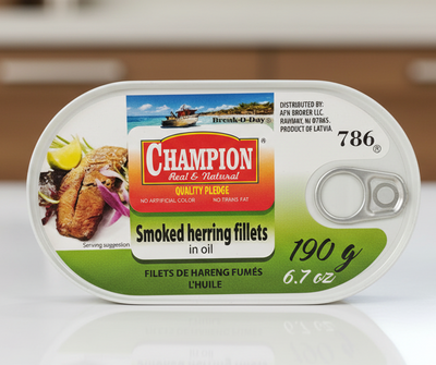 Can of Champion smoked herring fillets on a white background