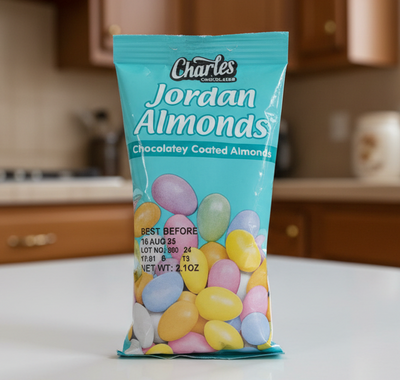 Bag of Charles Jordan Almonds with colorful almonds on a white background