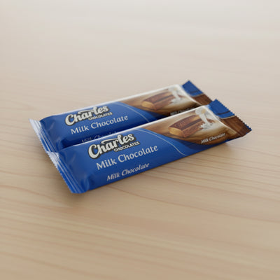 Three bars of Charles Milk Chocolate stacked on top of each other with blue packaging.