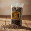 Bag of whole cumin with visible brand label on a white background
