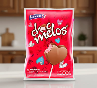 Red packaging of Chocolates Melos with a heart-shaped chocolate on a stick, featuring the Colombina brand.