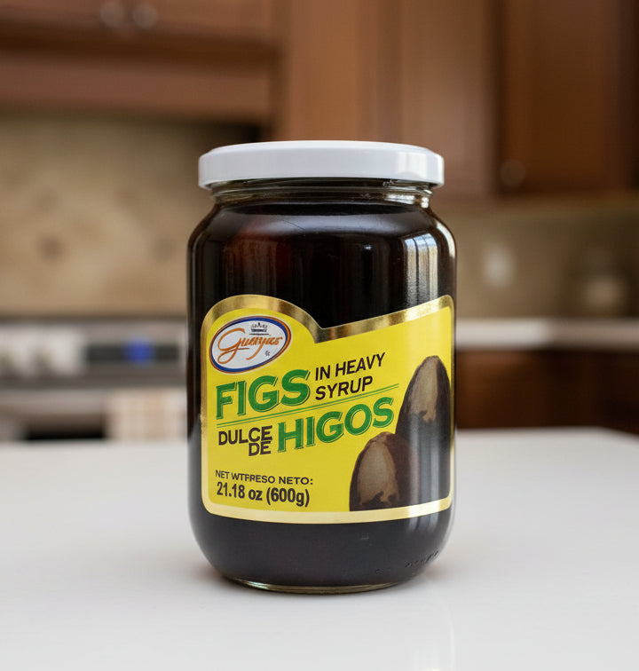 Jar of figs in heavy syrup with a yellow label on a white background