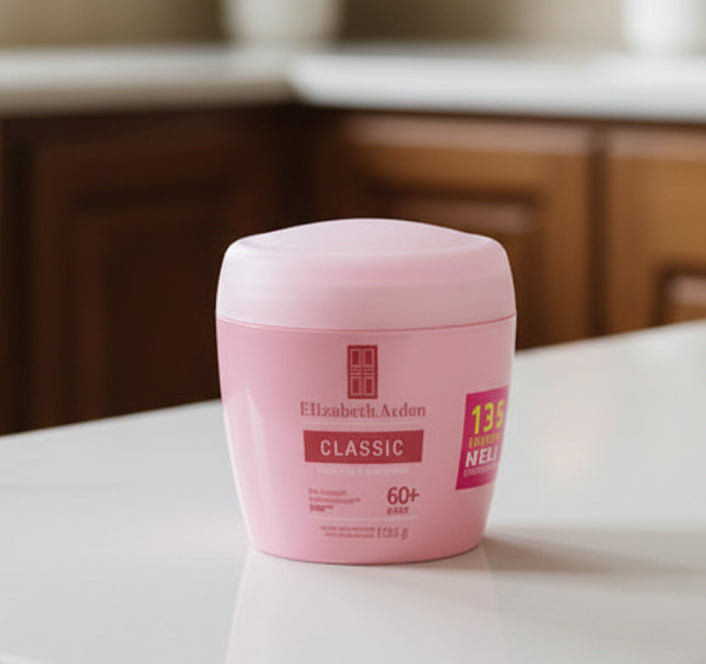 Stack of pink skincare bottles with visible branding on a shelf.