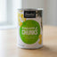 Can of Essential Everyday Pineapple Chunks in Heavy Syrup on a store shelf.