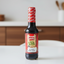 Bottle of Fruco Salsa de Soya soy sauce on a white background