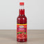 Bottle of Grace Cherry syrup on a white background