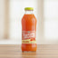 Bottle of Gracé Tropical Rhythms Mango Carrot juice on a white background