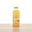 Bottle of Tropical Rhythms Pineapple Ginger juice with a yellow label on a white background