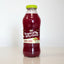 Bottle of Grace Tropical Rhythms Sorrel Ginger juice on a white background