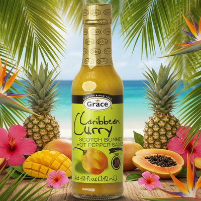Bottle of Grace Caribbean Curry Scotch Bonnet Hot Pepper Sauce on a white background