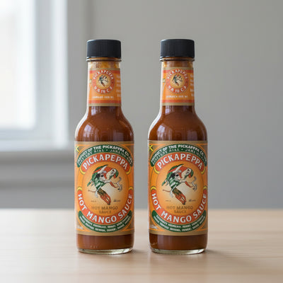 Hot sauce bottle with a colorful label on a white background