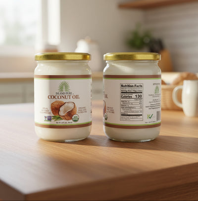 Two jars of Island Pura coconut oil on a white background