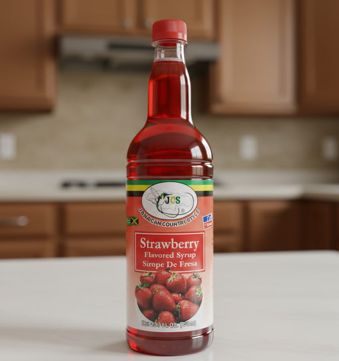 Bottle of strawberry flavored syrup with a visible brand label on a white background