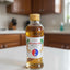 Hand holding a bottle of Korean ginseng drink with a blurred background