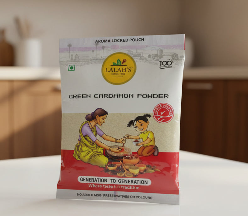 Package of Lalbahar Green Cardamom Powder held by a hand
