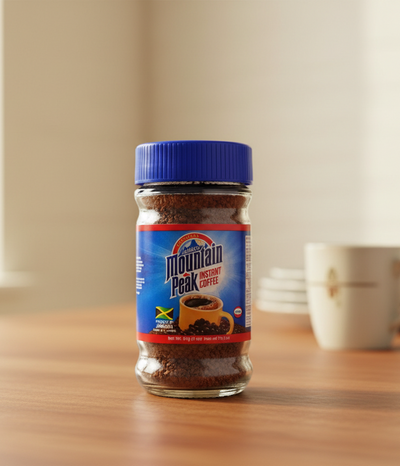 Jar of Mountain Peak instant coffee with blue lid on a white background