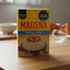 Maizena natilla coco packaging with a strawberry decoration on a black background