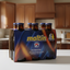 6-pack of Maltin Polen non-alcoholic malt beverage bottles with blue and orange design.