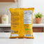 Yellow snack package with text and a logo on a dark background