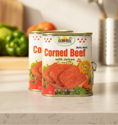 Two cans of OCHO RIOS Corned Beef with the product name and branding visible. One can is open, showing the corned beef inside, and the other is closed.