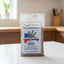 Packaged oregano with Dominican Republic label on a dark background