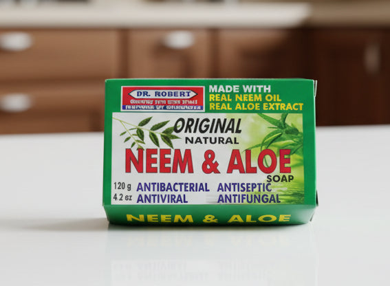 Box of Dr. Robert's Neem & Aloe soap on a surface with a blurred background