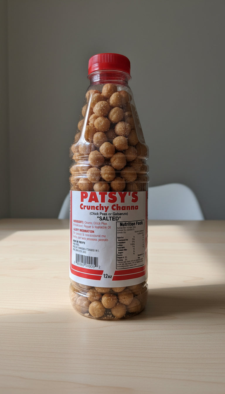 Bottle of Patsy's Crunchy Chana with a red cap on a metal surface.