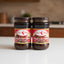 Two jars of 'Peró Chef' sauce on a store shelf with a price tag.