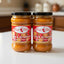 Two jars of Peru Chef Salsa de Aji Charapita on a store shelf with a price tag.