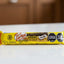 Yellow candy bar package with branding on a white background