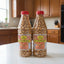 Bottles of R.B.'s Snacks Salted Peanuts on a store shelf with a price tag.
