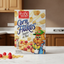 Box of Red & White Corn Flakes with a cartoon cat character on a white background