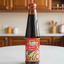 Bottle of Royal Montego Oyster Sauce on a white background