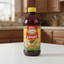 Bottle of Royal Montego Jamaican Ginger Flavoring on a white background