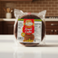 Packaged Jamaican fruit cake with Montego label on a clear background