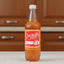 Bottle of Solo Quince with a red label on a white background