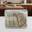 Two pieces of bread in a white container with 'Quince Supermarket' logo.